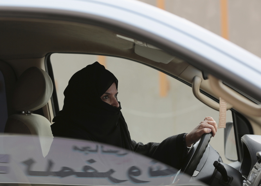 Aziza Yousef drives a car on a highway in Riyadh, Saudi Arabia, as part of a campaign to defy Saudi Arabia’s ban on women driving. This past year, Saudi Arabia laid the groundwork for momentous change next year in the conservative kingdom, defying its own reputation for slow-paced, cautious reforms.