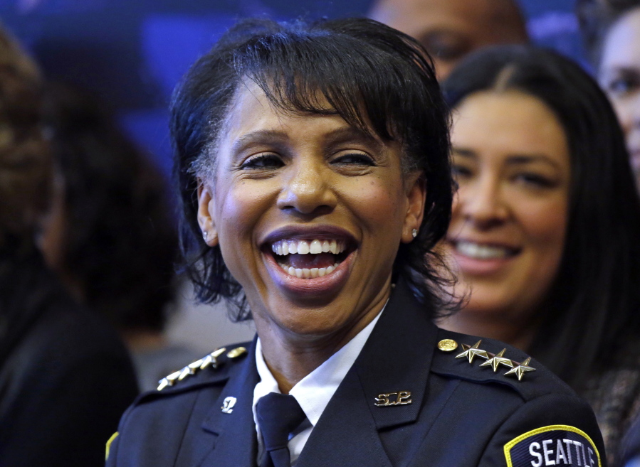 Seattle Deputy Police Chief Carmen Best smiles Monday at a news conference announcing that Seattle Police Chief Kathleen O’Toole will leave her job at the end of the year.