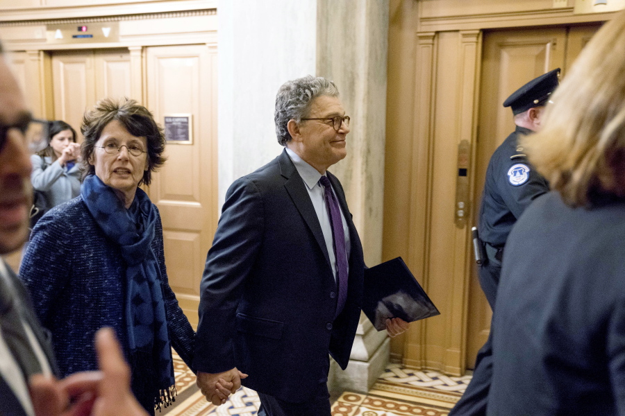 Sen. Al Franken, D-Minn., arrives with his wife Franni Bryson, left, on Capitol Hill in Washington, on Thursday.
