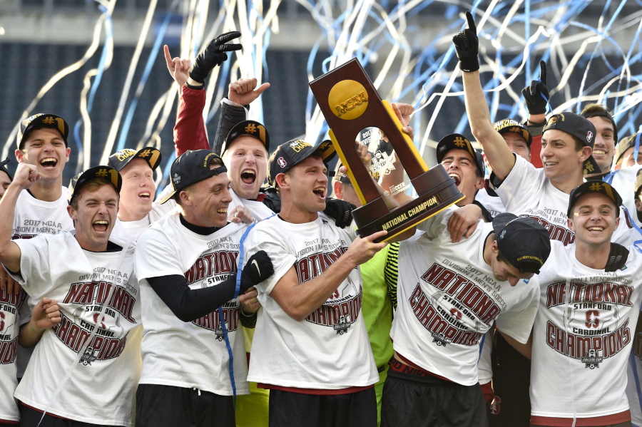 Members of the Stanford soccer team celebrate after winning the NCAA College Cup championship soccer match against Indiana, Sunday, Dec. 10, 2017, in Chester, Pa.