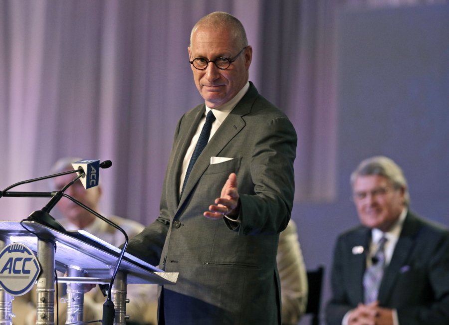 ESPN president John Skipper gestures as he talks about the new ACC/ESPN Network during a news conference at the Atlantic Coast Conference Football Kickoff in Charlotte, N.C. Skipper says he is resigning to take care of a substance abuse problem. The sports network says its former president, George Bodenheimer, will take over as acting head of the company for the next 90 days.