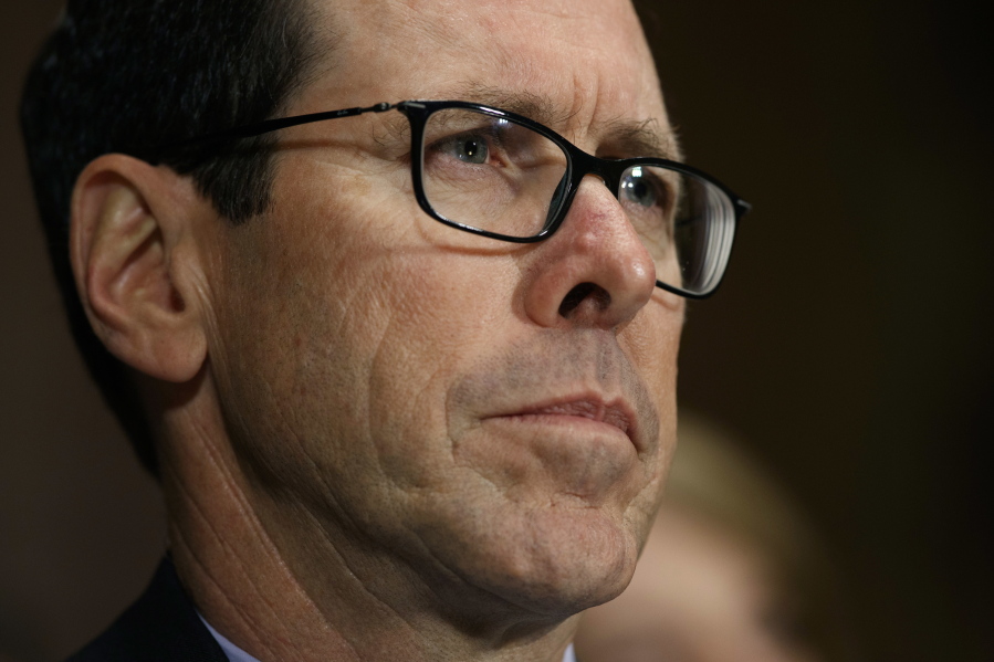 FILE - In this Dec. 7, 2016 file photo, AT&T Chairman and CEO Randall Stephenson listens on Capitol Hill in Washington, while testifying before a Senate Judiciary subcommittee hearing on the proposed merger between AT&T and Time Warner. After an exchange between AT&T’s CEO and a union representing its workers, the company says it took steps to pay workers a $1,000 bonus in response to President Donald Trump’s tax cuts. The Communications Workers of America had pushed AT&T last month to guarantee workers would receive the $4,000 raise that White House economists said would be the result of the corporate tax cuts.