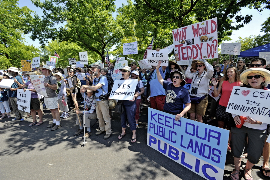 FILE - In this July 16, 2017 file photo, protesters show their support for the Cascade-Siskiyou National Monument at the Medford Bureau of Land Management office in Medford, Ore. The Trump administration has agreed to resume litigation over the expansion of Oregon’s Cascade-Siskiyou National Monument on Jan. 15, 2018, unless it resolves the dispute first.
