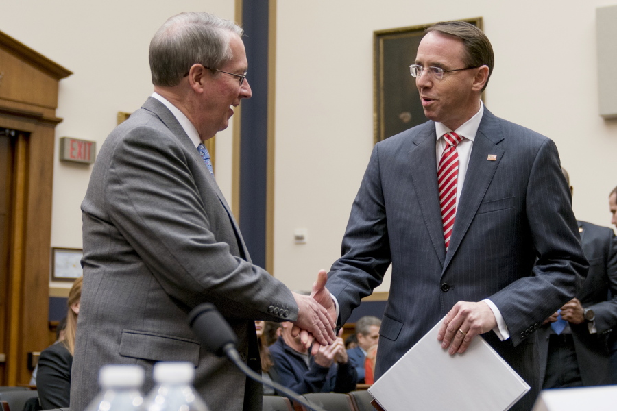 House Judiciary Committee Chairman Bob Goodlatte, R-Va., left, shakes hands with Deputy Attorney General Rod Rosenstein, right, as he arrives to testify before a House Committee on the Judiciary oversight hearing on Capitol Hill, Wednesday, Dec. 13, 2017 in Washington.