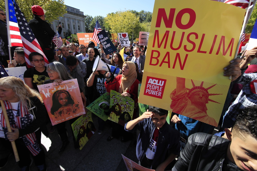 Protestors gather Oct. 18 at a rally in Washington. The Supreme Court is allowing the Trump administration to fully enforce a ban on travel to the United States by residents of six mostly Muslim countries. The justices say in an order on Dec. 4, that the policy can take full effect even as legal challenges against it make their way through the courts.