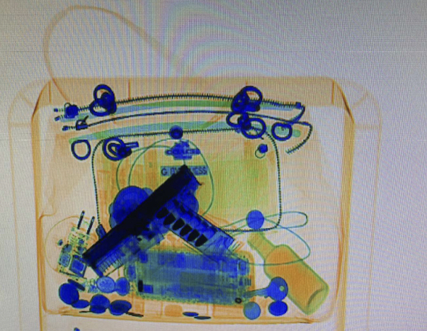 Security agents took this X-ray of a Vancouver police detective's purse while she recently went through an airport checkpoint. According to a report from Port of Portland Police Department, the gun was removed and the police officer passed through for her flight while a friend came to retrieve her gun.