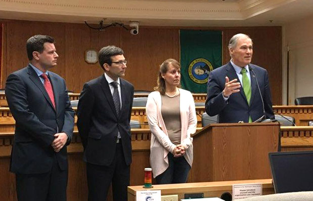 Gov. Jay Inslee speaks at a press conference on Thursday in Olympia. From right are state Rep. David Sawyer, D-Tacoma, state Attorney general Bob Ferguson and Sen. Ann Rivers, R-La Center.
