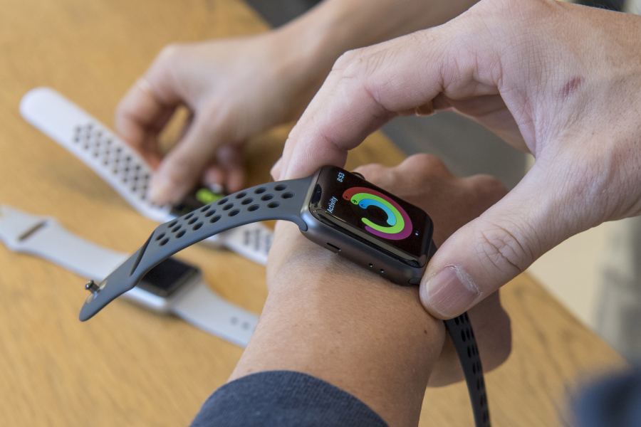 A customer tries on an Apple watch series 3 device in San Francisco on Sept. 22, 2017. MUST CREDIT: Bloomberg photo by David Paul Morris.