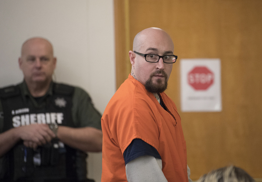 Christopher Ollar returns to his seat as he appears Jan. 5 in Clark County Superior Court to enter a guilty plea for a September stabbing in Vancouver’s Ogden neighborhood. He was sentenced Friday to 18 months in prison.