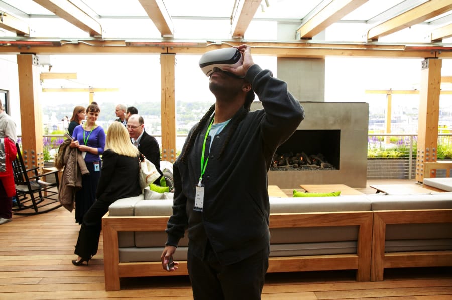 A visitor tries on a virtual-reality headset at Facebook’s Seattle offices in 2017. The company is investing heavily in bringing virtual and augmented reality into its social network.