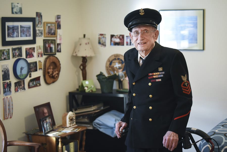 Jim Christian, a 100-year-old Navy veteran, is pictured in his World War II uniform at his home in Vancouver, Ariane Kunze/The Columbian
