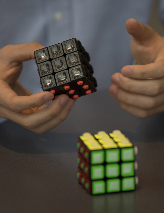 Skyview High School senior Carson Mowrer, 17, describes how the tactile Rubik’s Cube works so people with visual impairments can solve the puzzle.