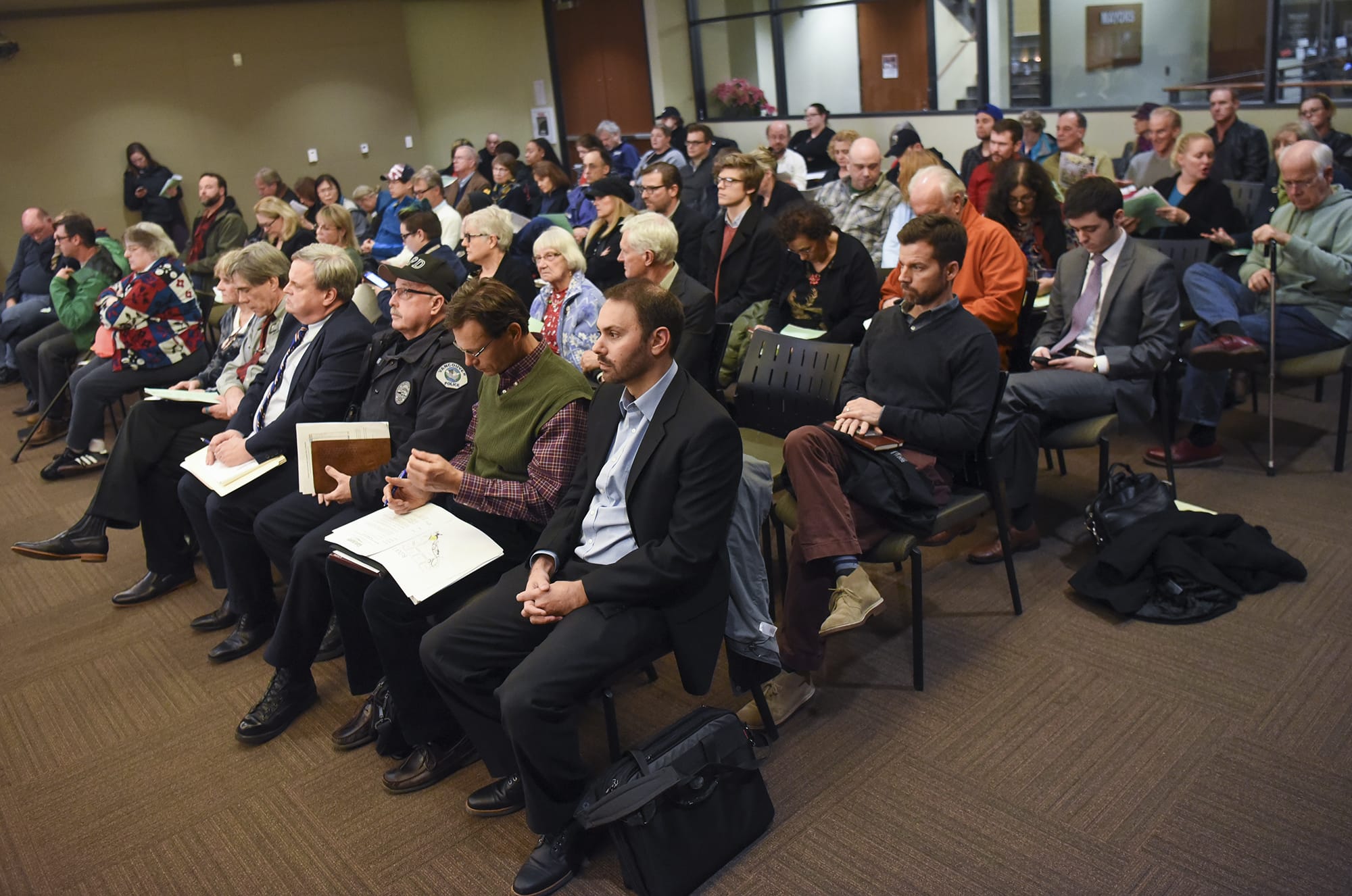 A large crowd of citizens and community members filled the council chambers at City Hall, Tuesday December 19, 2017, for the public hearing on the relocation of the day center to the former state Fish and Wildlife building in central Vancouver.