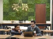 Amey Laud, left, and Josh Iwata, employees of ClassHero, work together at CoLab, a shared office space in Vancouver. CoLab purchased competitor Columbia Collective and officially took over the space Jan. 1.