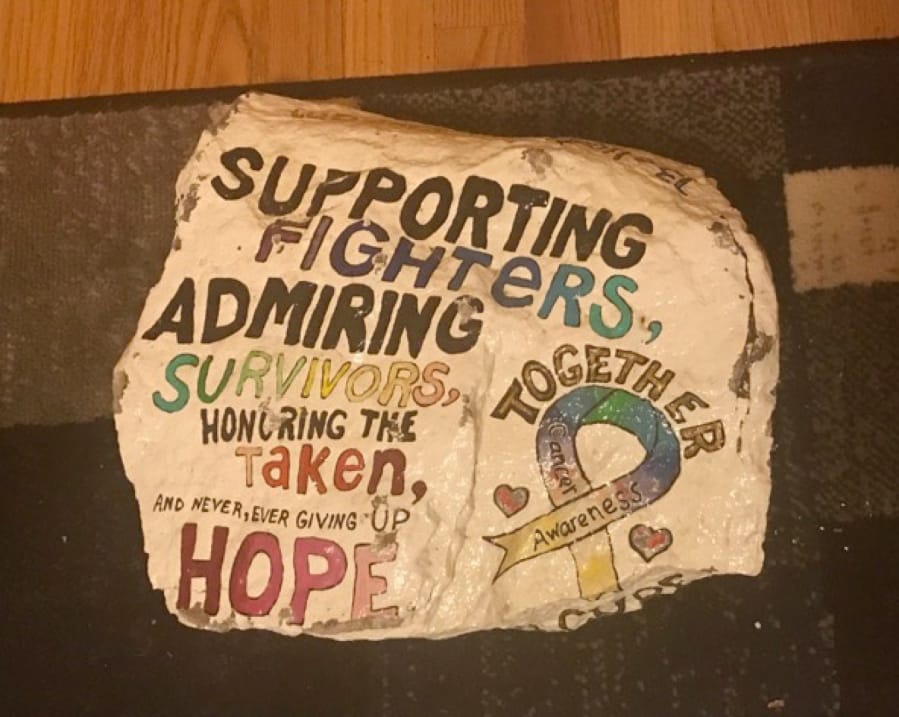 With the help of a good Samaritan, this cancer memorial rock was returned to owner Teresa Marble of Felida on Monday. Marble said the rock is a bit beat up, but she is thrilled to have it back.