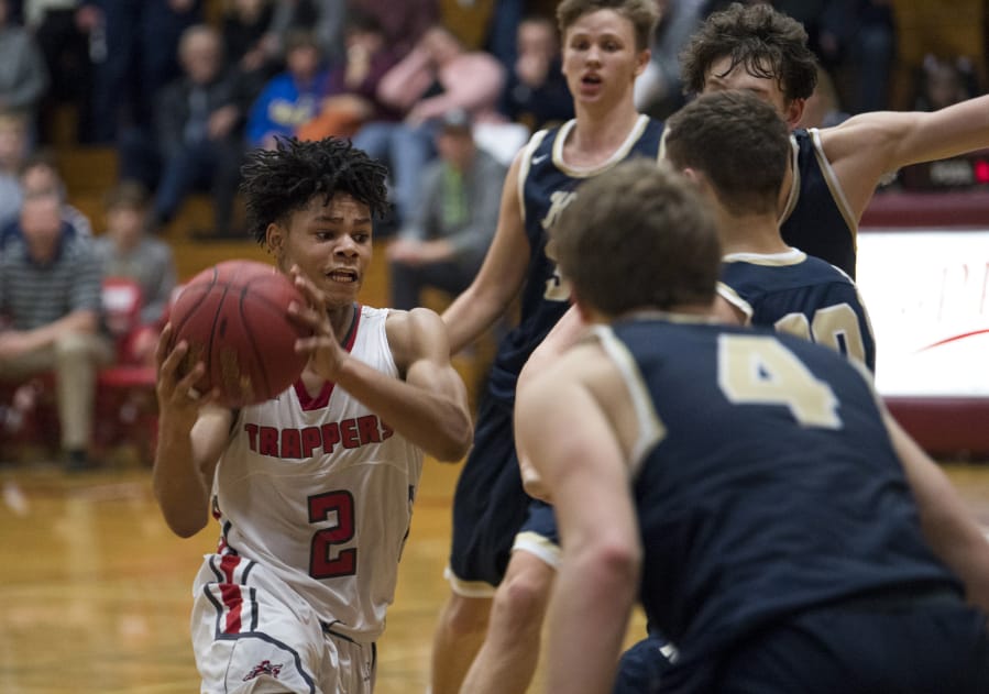Fort Vancouver’s Johnny Green (2) moves toward the basket during the final seconds of Friday night’s game against Kelso. Green was called for a charge on the play, allowing the Hilanders to seal the victory.