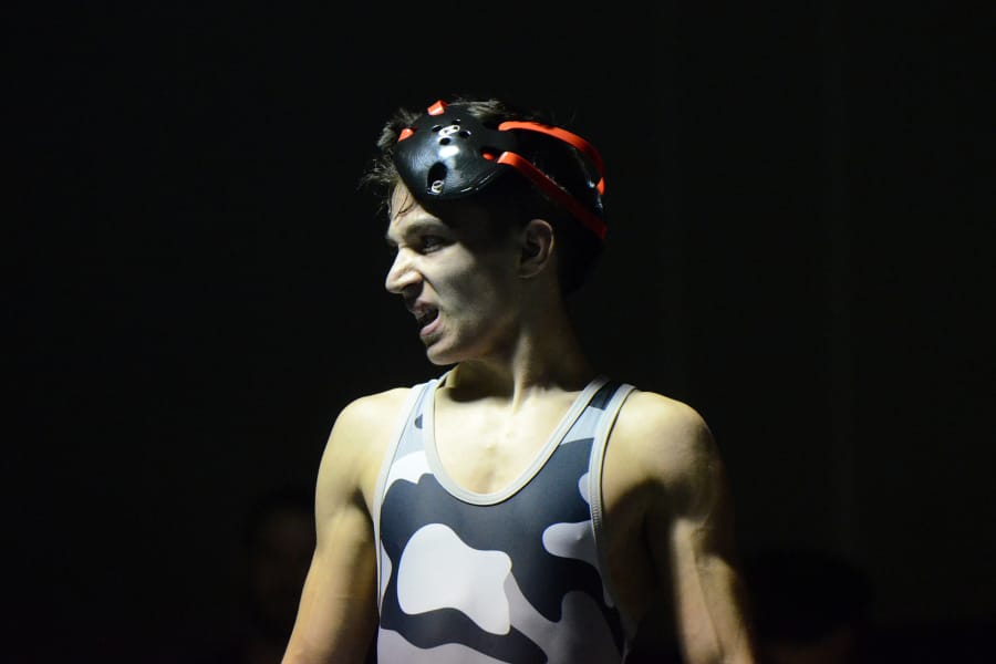 Union’s Brandon Esperto takes his headgear off after beating Columbia River’s Rexl Lamkin to win the 113-pound weight class at the 47th Clark County Wrestling Championship at Skyview. Five Titans wrestlers claimed county titles as Union won its ninth straight team title.