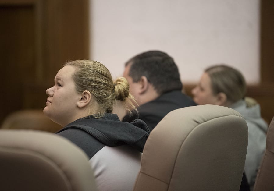 Skylar Stevens of Washougal, left, joins her mom, Melissa Stevens, right, as they prepare to be sentenced in Clark County Superior Court on Friday for the death of their dog. Both women will be screened to see if they are eligible for work release confinement.