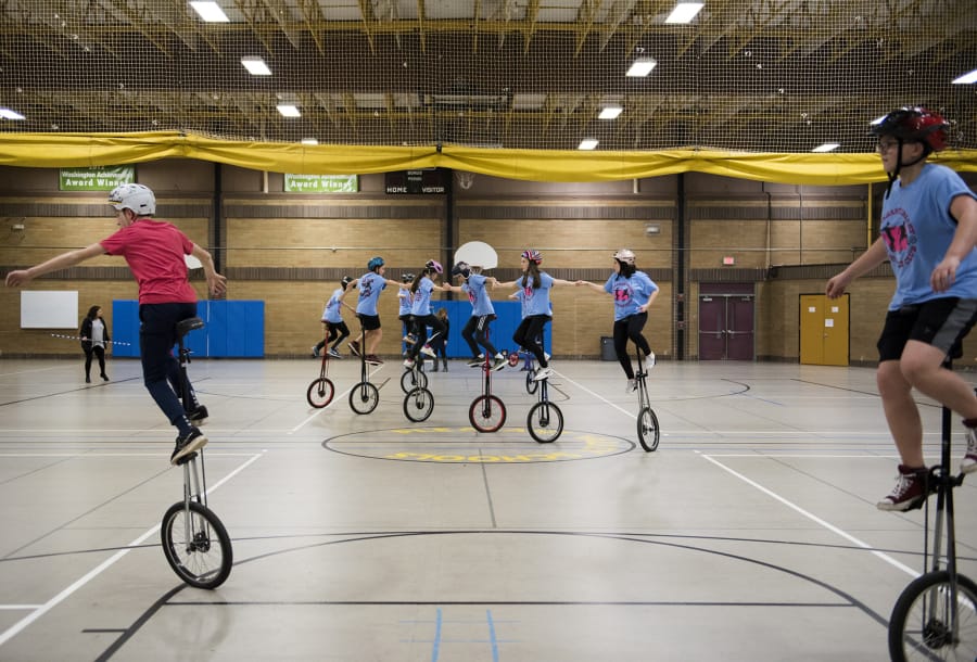 A spinning line of extra-tall “giraffe” unicyclists rehearses staying linked, and staying graceful, while balancing five feet over the floor of the Pleasant Valley Middle School gym. The Pleasant Valley Unicycle Team displays its unlikely skills during halftime shows for sports games all over Clark County.