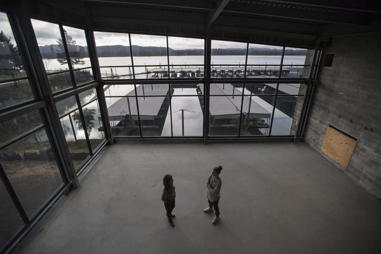 After almost a decade in limbo, the Black Pearl at the Port of Camas-Washougal may finally open for business as an events center this year. Kim Sherertz, left, and son Cole chat on the second floor in front of its sweeping views of the Columbia River.