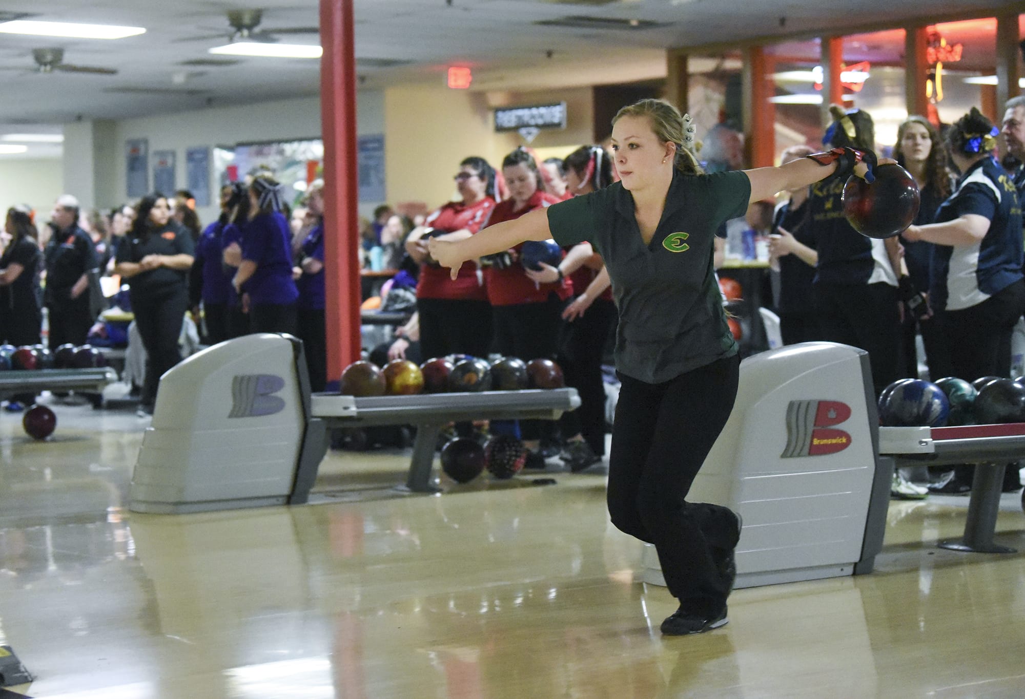 Evergreen’s Lexi Henderson bowls for her team during the 4A and 3A district girls bowling tournaments at Allen's Crosley Lanes in Vancouver, Friday January 26, 2018.