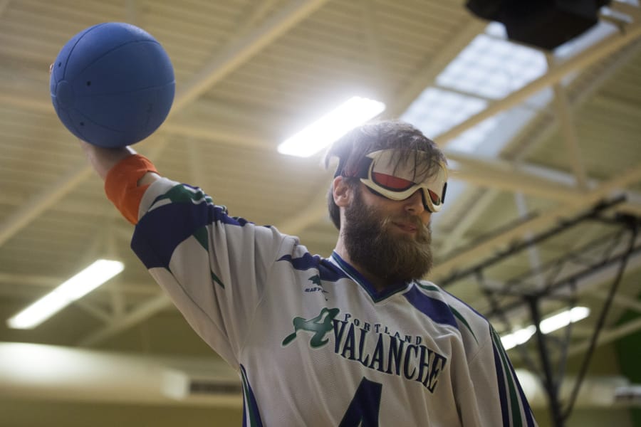 Natalie Behring/for The Columbian Goalball player John Hinman - who lives in Vancouver and plays for the Portland Avalanche - prepares to hurl a goalball during a practice session in the Kennedy Fitness Center at the Washington State School for the Blind. The Northwest Association for Blind Athletes hosted a skills clinic and scrimmage with the Tacoma Typhoon on Saturday afternoon.