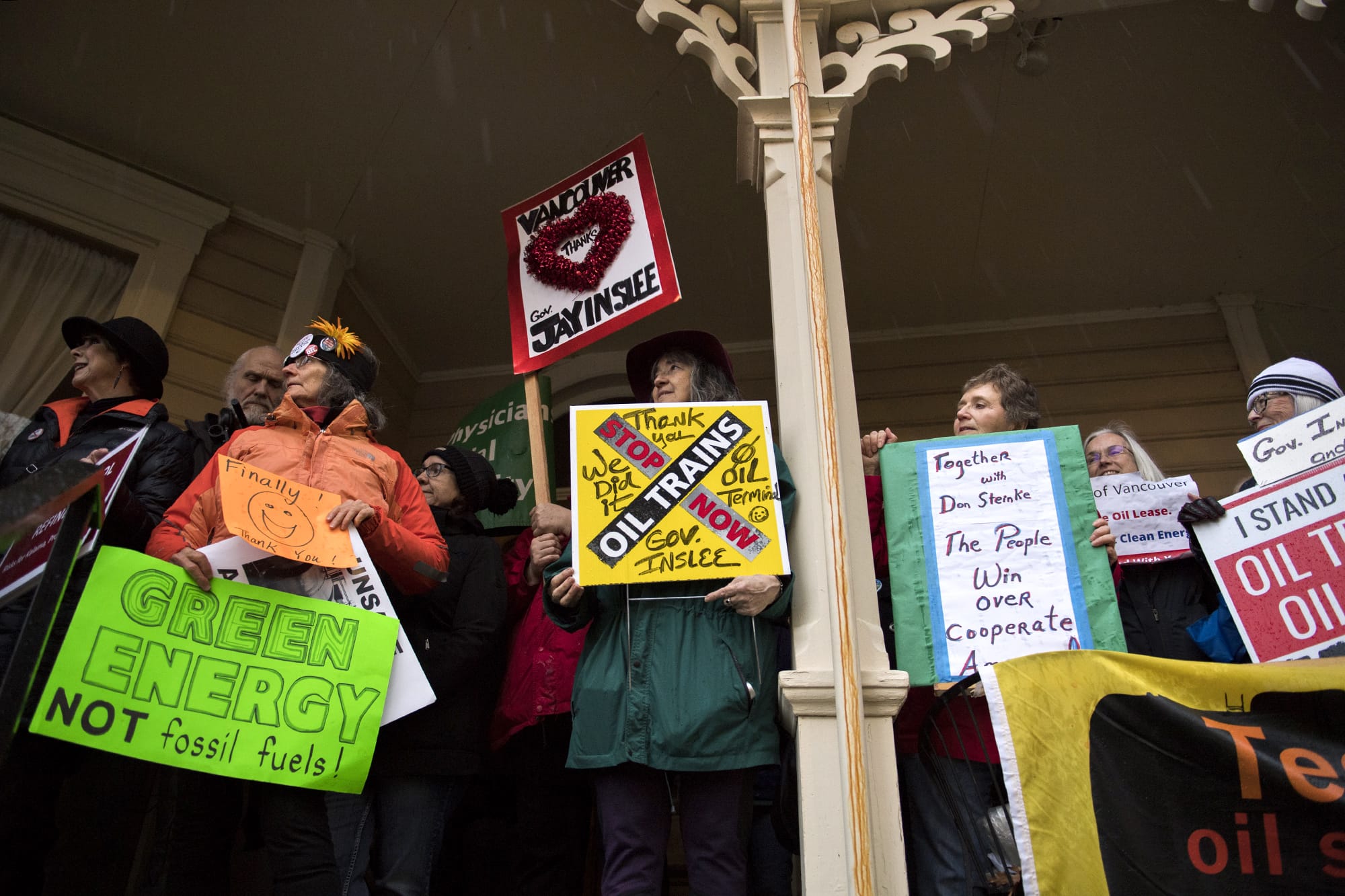 Opponents of the proposed Vancouver Energy oil-by-rail terminal celebrate the project's rejection Monday by Washington Gov. Jay Inslee at the Slocum House in downtown Vancouver on Jan. 29, 2018.