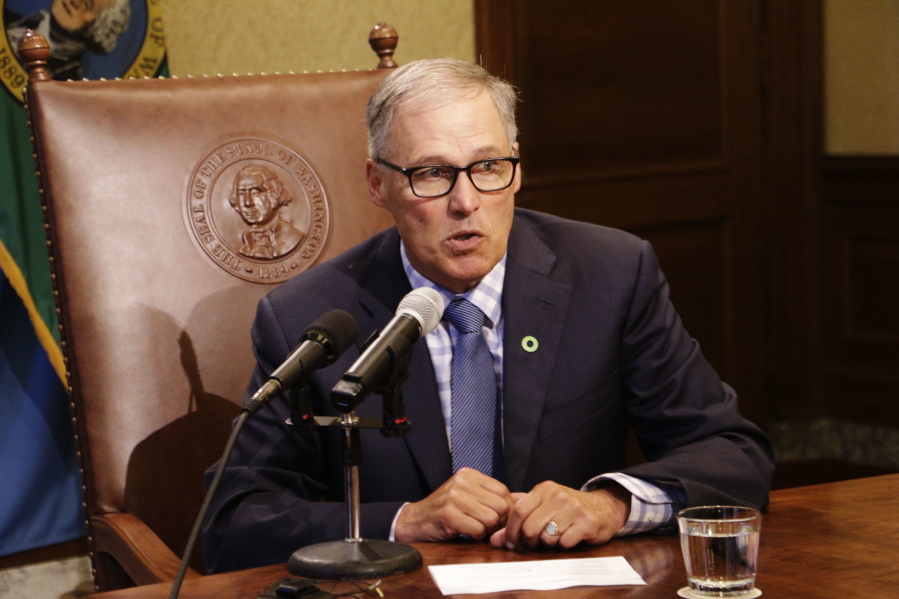 Gov. Jay Inslee talks to reporters about ongoing budget negotiations, in Olympia. As chairman of the Democratic Governors Association, Inslee will be working to elect governors from his party this year to counteract the Republican dominance in state legislatures. Governors in most states are key to the redistricting process that will follow the 2020 Census.