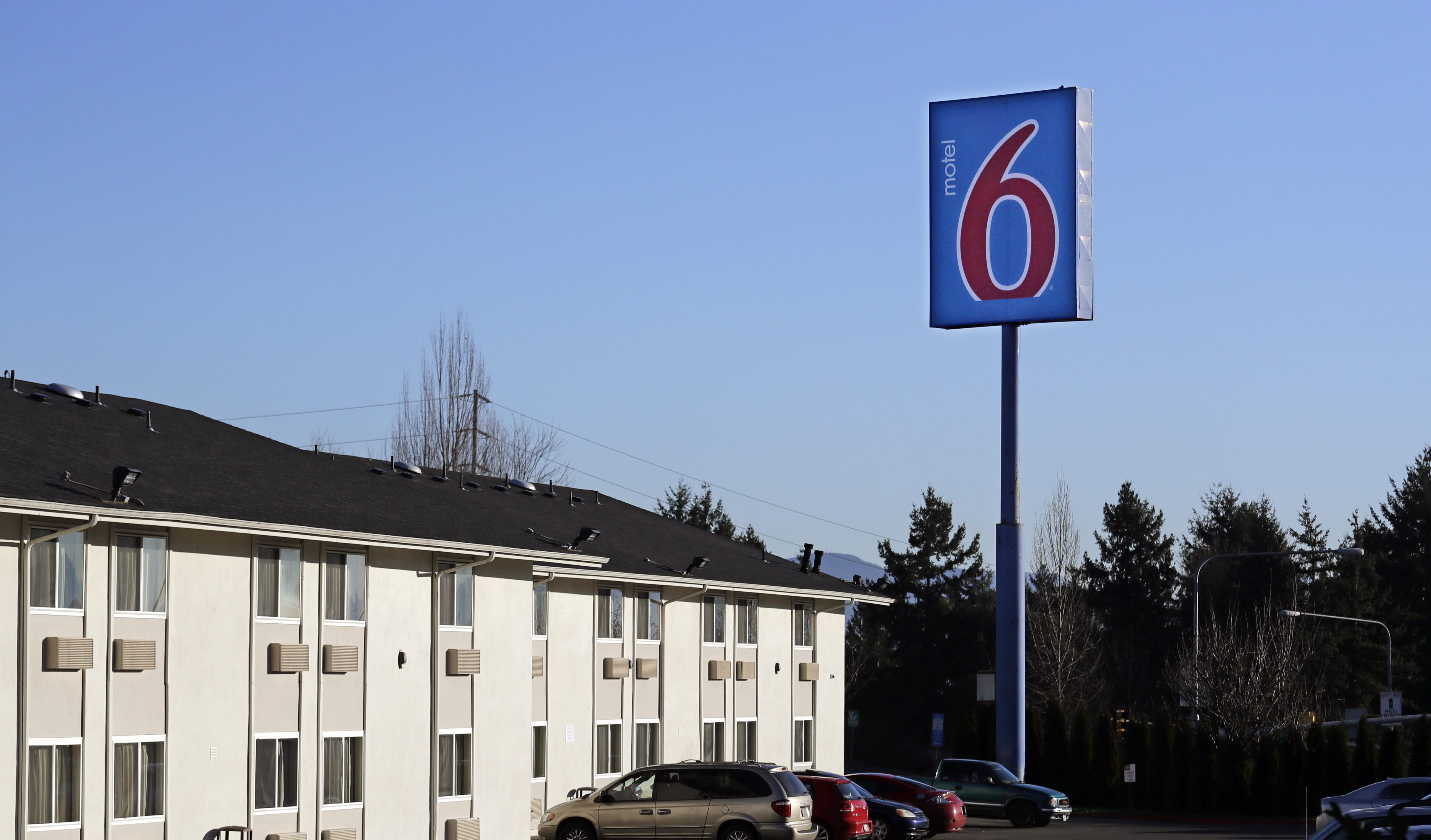 A Motel 6 motel is seen Wednesday, Jan. 3, 2018, in SeaTac, Wash. Washington's attorney general is suing Motel 6, saying the budget hotel disclosed the personal information of thousands of guests to federal immigration authorities in violation of state law. Attorney General Bob Ferguson said at a news conference Wednesday that the motel divulged to the U.S. Immigration and Customs Enforcement the names, dates of birth, license plate numbers and room numbers of more than 9,000 guests at six locations throughout the state.