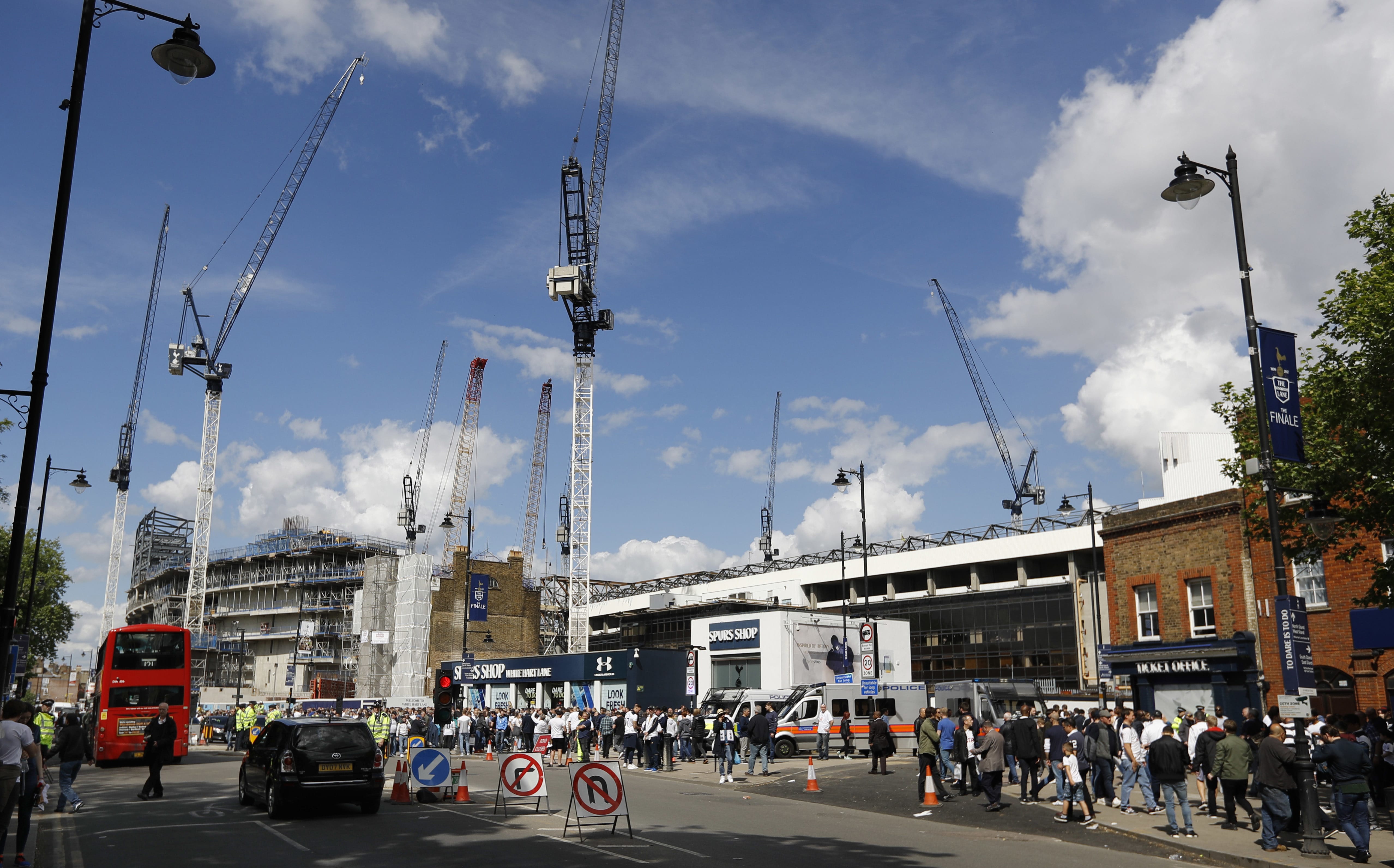 Soccer fans arrive for a match between Tottenham Hotspur and Manchester United as cranes being used for construction work are seen at White Hart Lane stadium in London. The Oakland Raiders will host the Seattle Seahawks in the first NFL game at the new London stadium of English Premier League club Tottenham. The game will be played in Week 6 of the NFL season on Oct. 14.