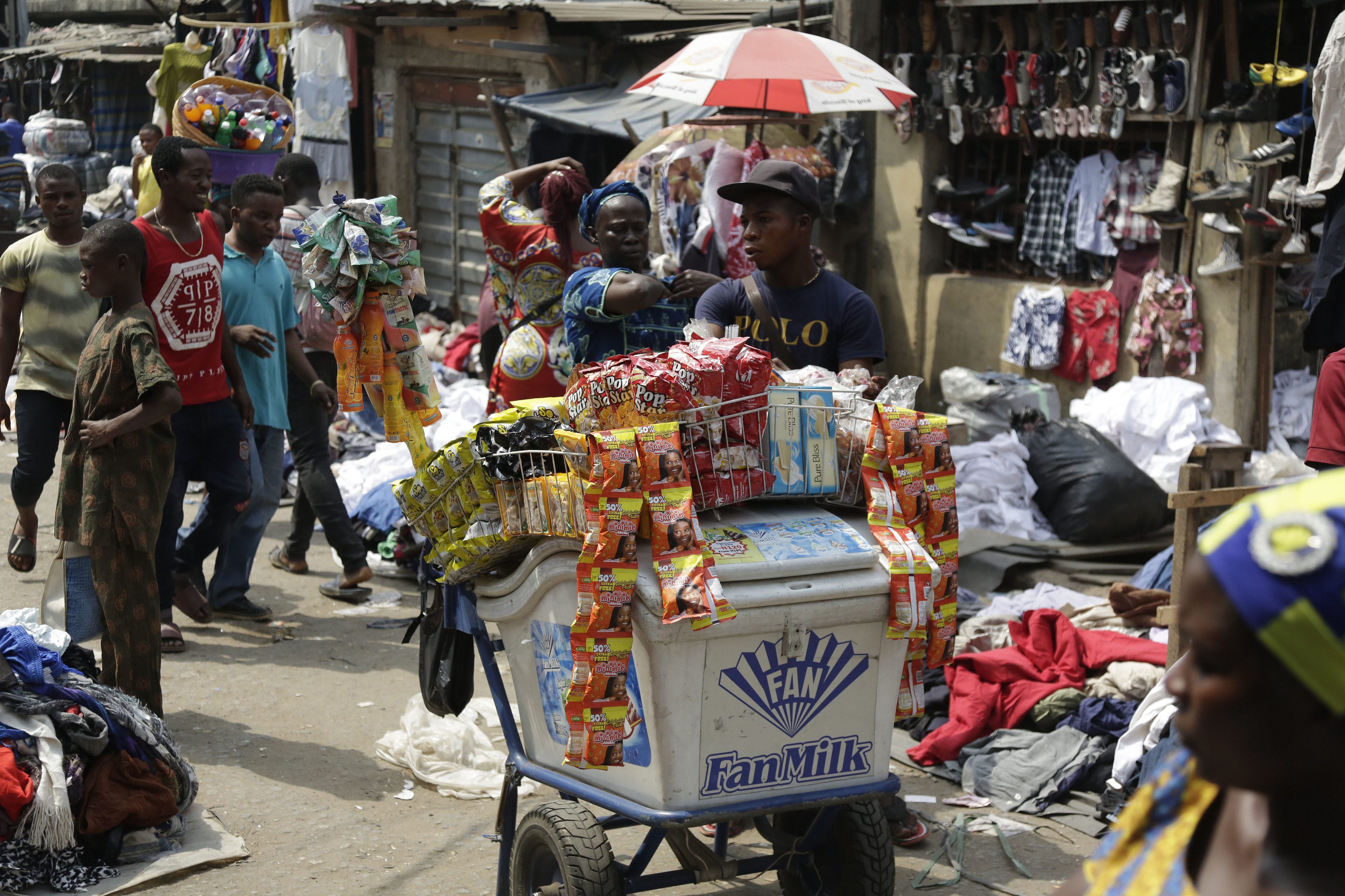 Pedestrians shop in a roadside market in Lagos, Nigeria, Friday, Jan. 12, 2018. Africans were shocked on Friday to find President Donald Trump had finally taken an interest in their continent. But it wasn't what people had hoped for. Using vulgar language, Trump on Thursday questioned why the U.S. would accept more immigrants from Haiti and "shithole countries" in Africa rather than places like Norway in rejecting a bipartisan immigration deal. On Friday he denied using that language.