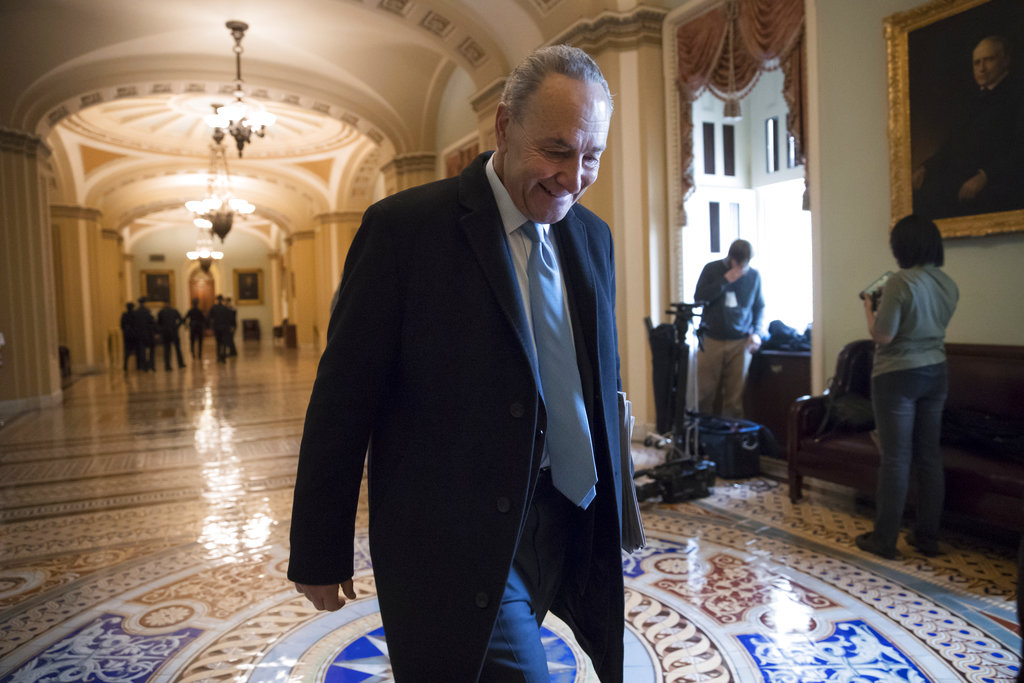 Senate Minority Leader Chuck Schumer, D-N.Y., arrives at the Capitol at the start of the third day of the government shutdown, in Washington, Monday, Jan. 22, 2018. Schumer, arguably the most powerful Democrat in Washington, is trying to keep his party together to force a spending bill that would include protections for young immigrants. (AP Photo/J.