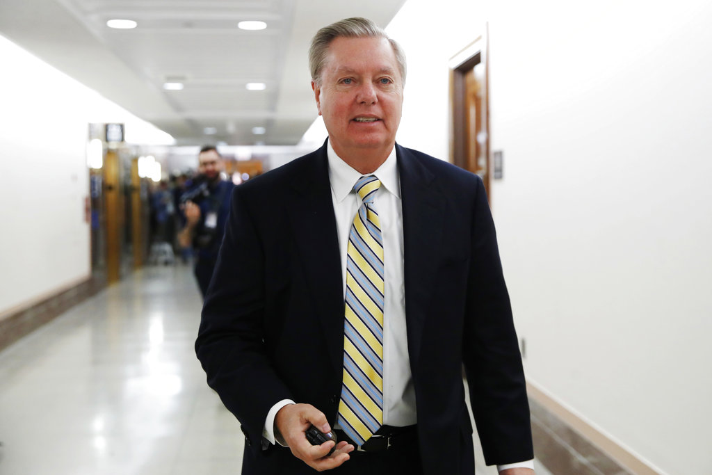 Sen. Lindsey Graham, R-S.C., leaves after meeting with a bipartisan group of senators, Monday Jan. 22, 2018, on Day Three of the government shutdown on Capitol Hill in Washington.