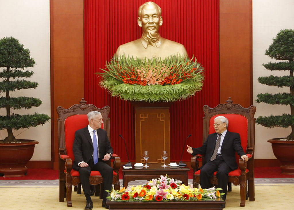U.S. Secretary of Defense Jim Mattis, left, listens during talks with Vietnam's Communist Party General Secretary Nguyen Phu Trong in Hanoi, Vietnam, Thursday, Jan. 25, 2018. In a move likely to irritate China, a U.S. Navy aircraft carrier is likely to visit Vietnam in March for the first time since the war, U.S. and Vietnamese officials said Thursday.