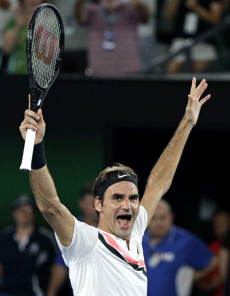 Switzerland's Roger Federer celebrates after defeating Croatia's Marin Cilic during the men's singles final at the Australian Open tennis championships in Melbourne, Australia, Sunday, Jan. 28, 2018.