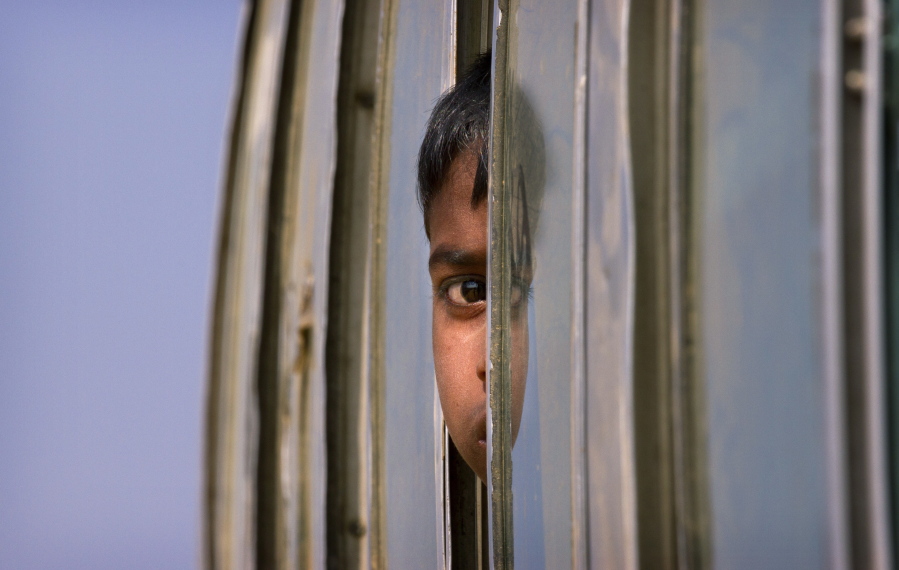 A Rohingya refugee boy who is among those being relocated from a camp near the Bangladesh Myanmar border looks out from the window of a bus as is brought to the Balukhali refugee camp, 50 kilometres (32 miles) from, Cox’s Bazar, Bangladesh, Thursday, Jan. 18, 2018. Bangladesh and Myanmar have agreed that they will try to complete the repatriation of hundreds of thousands of Rohingya Muslim refugees who fled from violence in Myanmar within two years, Bangladesh’s Foreign Ministry said.