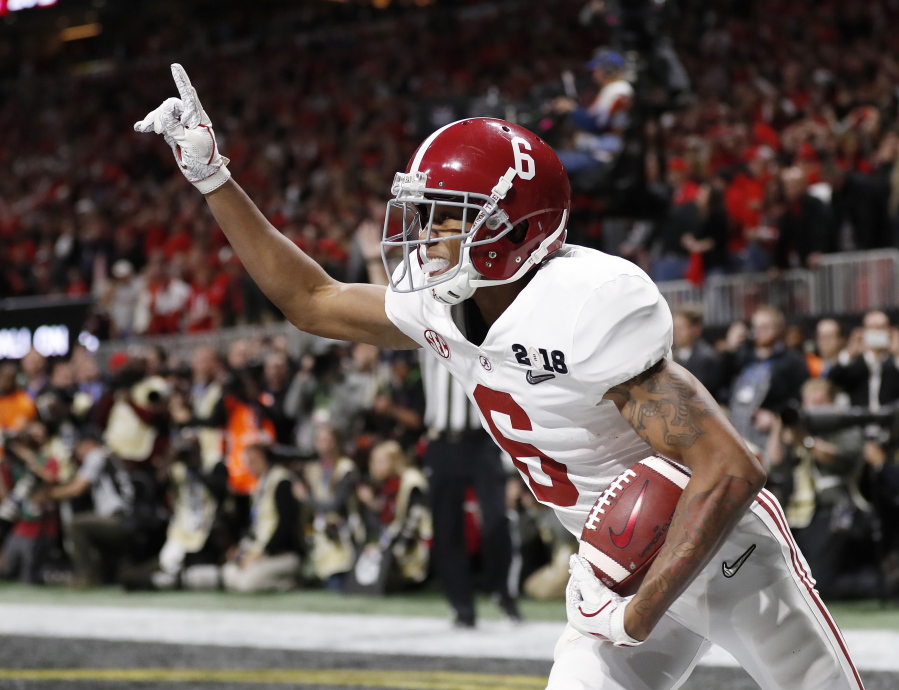 Alabama wide receiver DeVonta Smith (6) celebrates his touchdown during overtime of the NCAA college football playoff championship game against Georgia, Monday, Jan. 8, 2018, in Atlanta. Alabama won 26-23 in overtime.