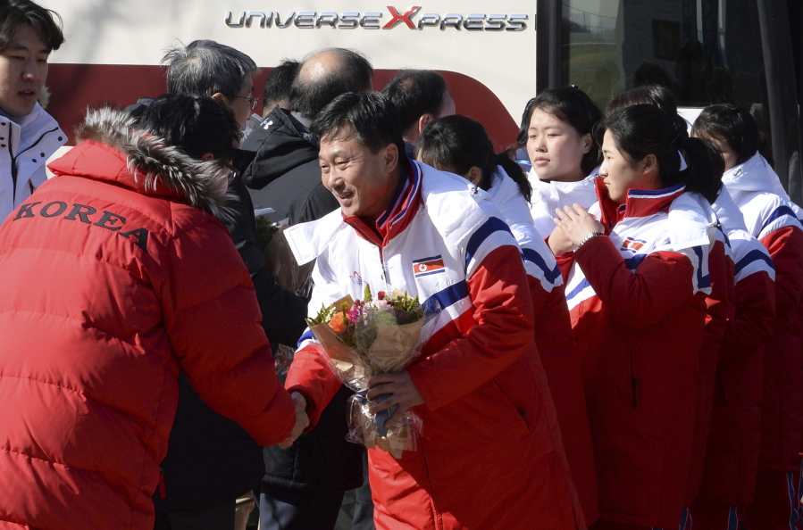 The North Korean women’s ice hockey players are greeted as they arrive at the South Korea’s national training center Thursday in Jincheon, South Korea. Twelve North Korean female hockey players have crossed the border into South Korea to form the rivals’ first-ever Olympic team during next month’s Pyeongchang Winter Games.