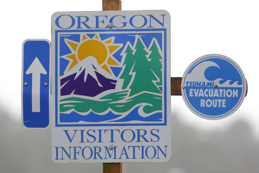 This March 16, 2011, file photo shows a tsunami evacuation sign in Cannon Beach, Ore. The big earthquake off the coast of Alaska triggered a tsunami watch for the Oregon Coast during the predawn hours Tuesday,Jan. 23, 2018, and while no tidal wave materialized, officials said it is a wake-up call.
