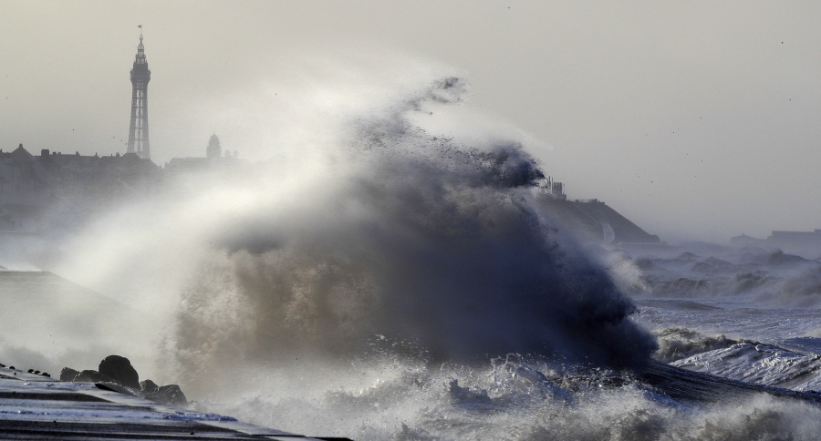 Big waves crash over the sea walls in Blackpool northwest England as a storm lashed the UK with violent storm-force winds of up to 100 mph, leaving thousands of homes without power and hitting transport links Wednesda.