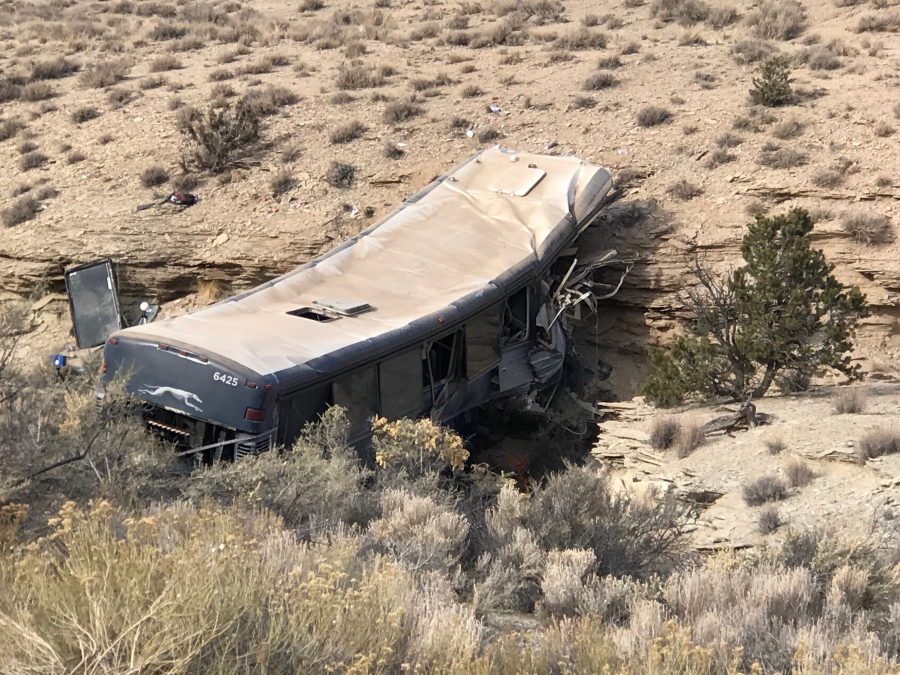 The aftermath of a late-Sunday Greyhound bus crash is seen on Monday, Jan. 1, 2018 in Emery County. A 13-year-old girl died and 11 others were hospitalized when the bus went off the freeway and crashed into a steep wash.