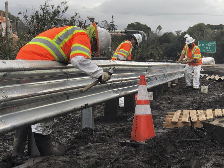 Caltrans workers continue their around-the-clock efforts Friday to clean-up and repair the damaged section of US 101 in Montecito, Calif., that was closed following flooding on Jan. 9. California officials say key coastal highway swamped by deadly mudslides has reopened Sunday after nearly 2-week closure.