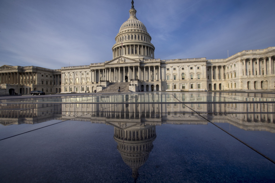 The Capitol in Washington. The government is financed through Friday, Jan. 19, and another temporary spending bill is needed to prevent a partial government shutdown after that. (AP Photo/J.