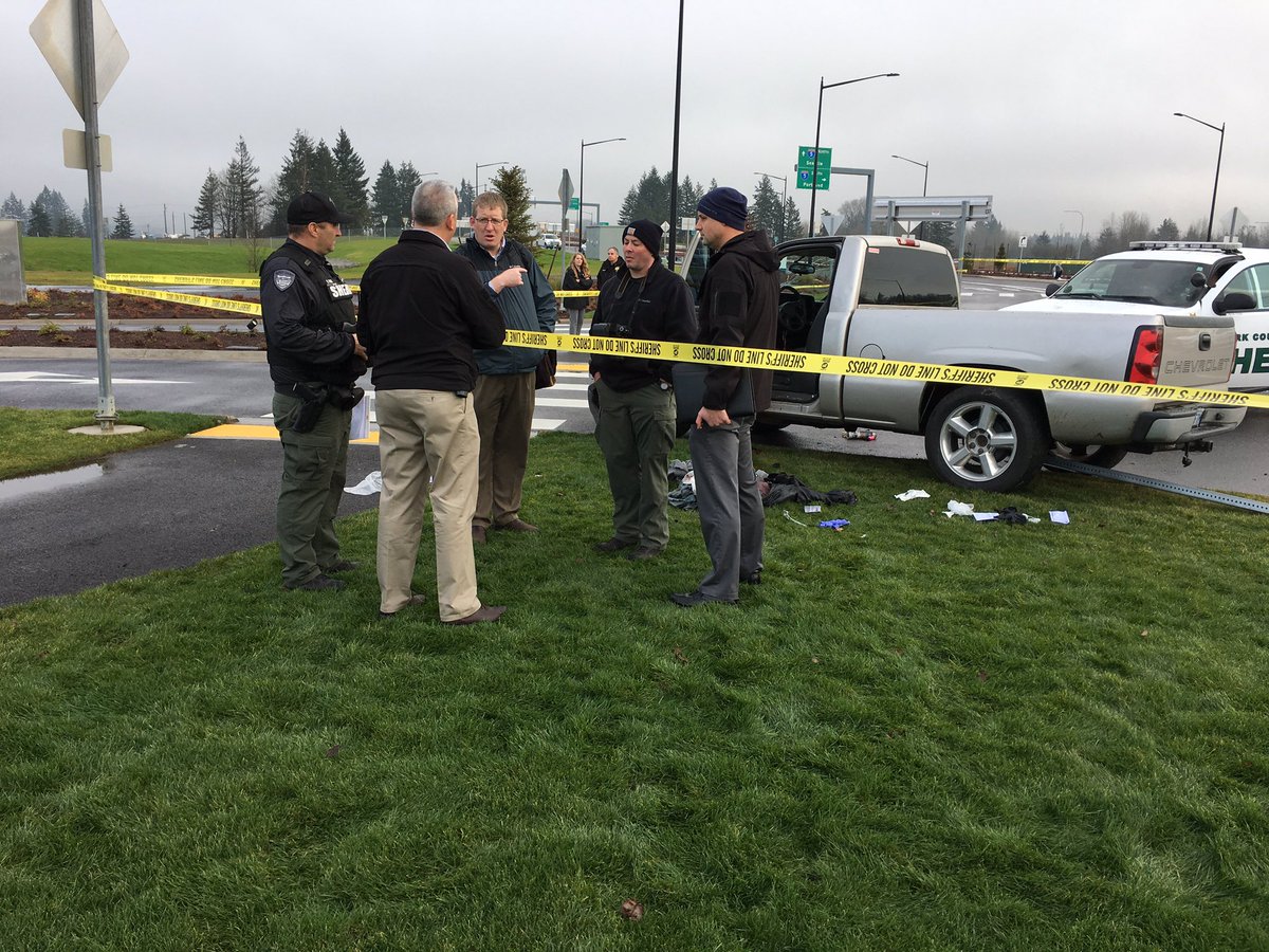 Clark County sheriff's detectives confer at the scene of a shooting that occurred inside this pickup truck as it was being driven near the Ilani Casino on Friday morning.