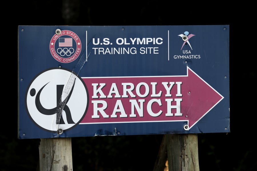 A sign points down the road to the Karolyi Ranch near New Waverly, Texas. Texas Gov. Greg Abbott on Tuesday, Jan. 30, 2018, has ordered a criminal investigation into claims that former doctor Larry Nassar abused some of his victims at the Texas ranch that was the training ground for U.S. women’s gymnastics .(AP Photo/David J.