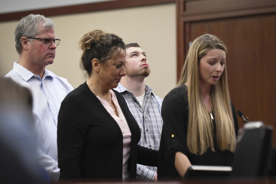 “I believe they are just as much a victim as myself,” Whitney Mergens says of her parents and boyfriend, who stand at her side Monday, Jan. 22, 2018, during the fifth day of victim impact statements against Larry Nassar in Ingham County Circuit Court. Nassar has admitted molesting athletes during treatment when he was employed by Michigan State University and USA Gymnastics, which trains Olympians. He will be sentenced on seven sexual assault charges this week.