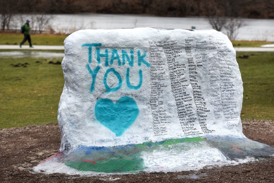 This Thursday, Jan. 25, 2018 photo shows The Rock on Michigan State University’s campus which was painted “Thank You” and and includes the names of the women who gave victim impact statements during the Larry Nassar sentencing hearing in East Lansing, Mich. Nassar is on his way to prison for the rest of his life for molesting scores of young female athletes, but the scandal is far from over at Michigan State University as victims, lawmakers and a judge demand to know why he wasn’t stopped years ago.