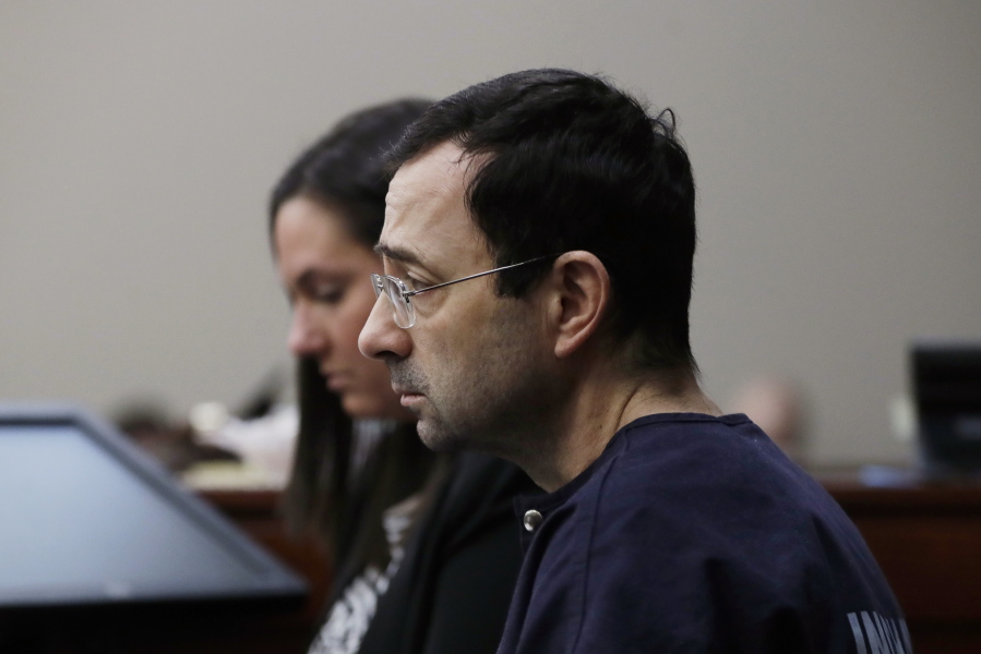 Dr. Larry Nassar is seated during the seventh day of his sentencing hearing Wednesday in Lansing, Mich. Nassar has admitted sexually assaulting athletes when he was employed by Michigan State University and USA Gymnastics, which is the sport’s national governing organization and trains Olympians.