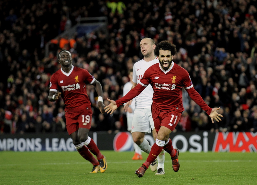 Liverpool’s Mohamed Salah, right, celebrates after scoring his side’s seventh goal during the Champions League Group E soccer match in Liverpool, England. Salah, one of the hottest soccer players in the world right now, was once rejected by his local team. That he succeeded anyway is being latched onto by fellow Egyptians as a sign of hope for a country for years mired by political instability and violence, deadly terrorist attacks and an economic crisis.