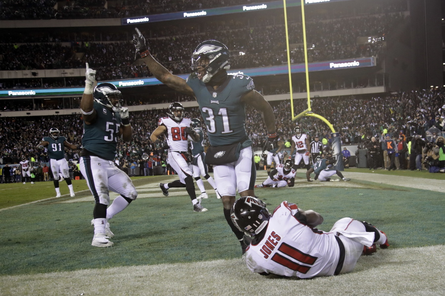 Philadelphia Eagles’ Jalen Mills (31) and Brandon Graham (55) celebrate after Atlanta Falcons’ Julio Jones (11) cannot catch a fourth down pass during the second half of an NFL divisional playoff football game, Saturday, Jan. 13, 2018, in Philadelphia. Philadelphia won 15-10.